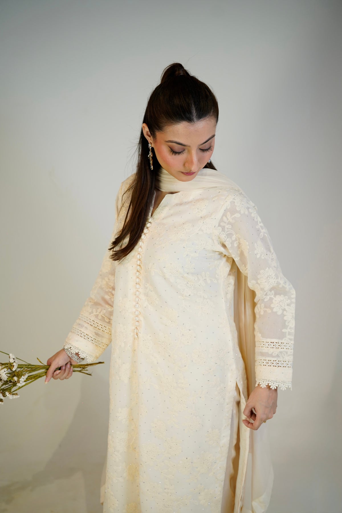 Chikankari hand-embroidery detail on off-white cotton